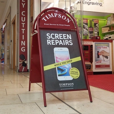  Booster In Shopping Centre Showing Timpson Screen Repair Artwork